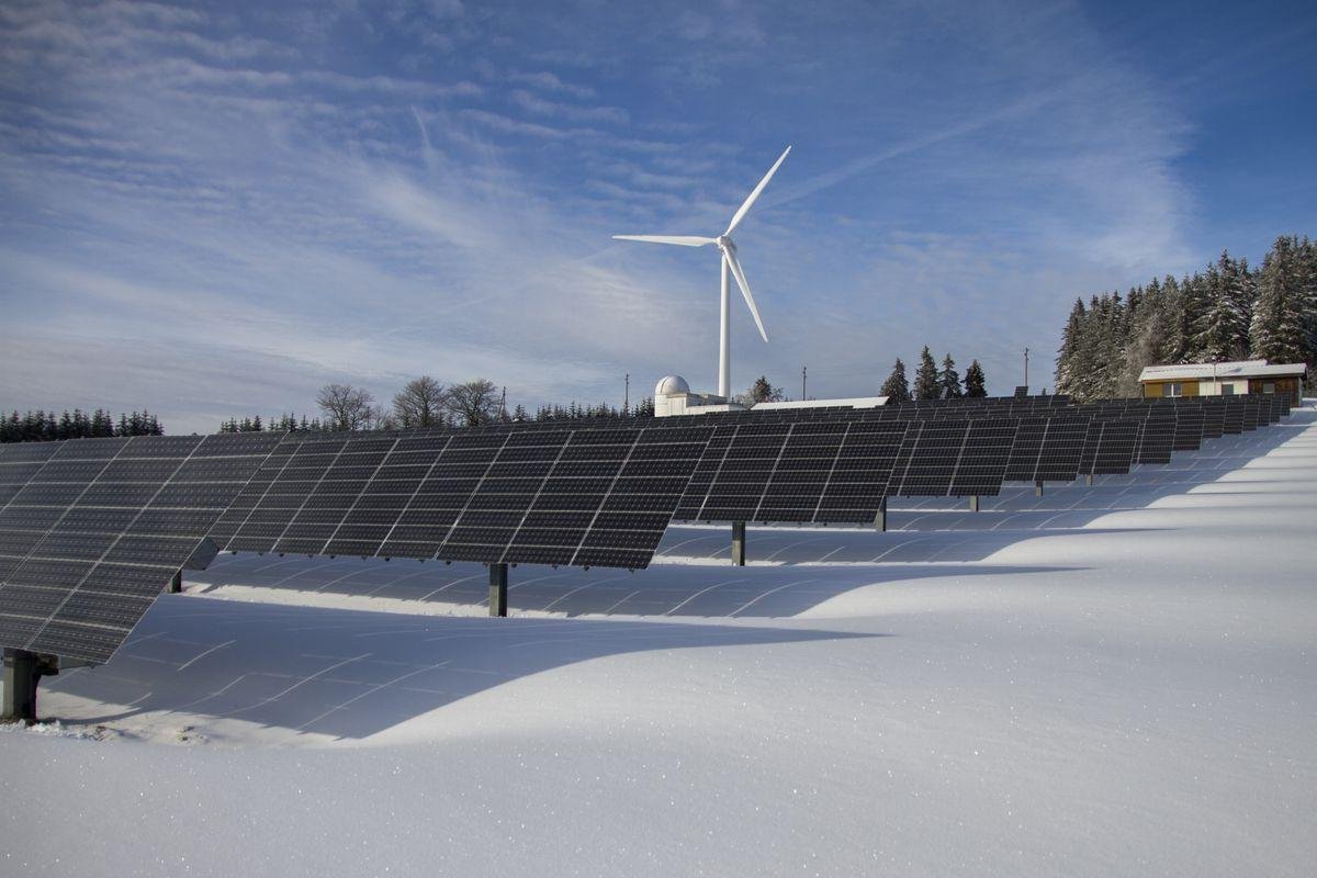 Clean solar panels in snow field - panel cleaning service